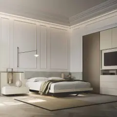 Modern bedroom with a bed, nightstand, wardrobe with TV, and elegant wall paneling.