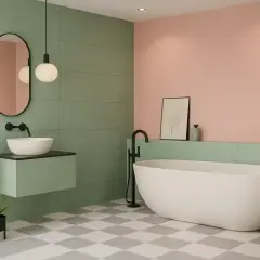 Salle de bain moderne avec baignoire îlot, lavabo suspendu et carrelage vert et rose. Idéal pour peindre le plafond de la salle de bain.
