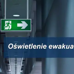 Zielony znak ewakuacyjny z biegnącą postacią i strzałką w prawo. Pod spodem napis "Oświetlenie ewakuacyjne".