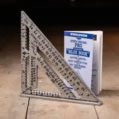 A Swanson Speed Square and its "Blue Book" guide, showing how to use a speed square for roof construction.