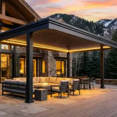 Modern pergola with integrated lighting over a deck, featuring outdoor seating and a fire pit. This image showcases how to build a pergola on a deck for ultimate outdoor living.