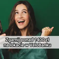 Uśmiechnięta kobieta trzyma telefon, a na ekranie widnieje napis "Zgarnij ponad 1400 zł na lokacie w VeloBanku".