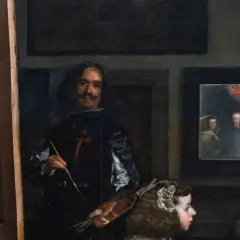 A painter, brush in hand, stands before a canvas, surrounded by royalty. This famous art from the Baroque period captures a moment of creation.
