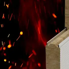 Przekrój materiału budowlanego z wełny mineralnej na tle płonących iskier.