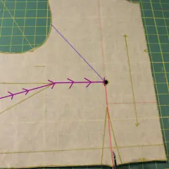 Sewing pattern piece showing how to shape bust darts. Purple arrows indicate the direction of the dart manipulation.