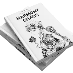 Stack of books titled "Harmony in Chaos" with a black and white illustration of a stylized figure.