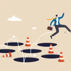 Un homme d'affaires saute par-dessus des trous, évitant les cônes de signalisation. Une métaphore visuelle pour surmonter les obstacles, comme un exemple d'arrêt de travail.