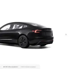 Czarna Tesla Model 3 widziana z tyłu i z boku.