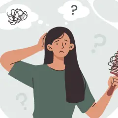 Mujer preocupada por la caída de pelo, se pregunta si la vitamina D podría ser la solución.