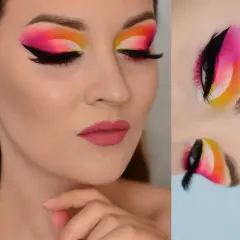 Wyrazisty makijaż oczu w stylu cut crease z neonowym gradientem od żółci, przez róż, po fiolet. Czarne kreski i długie rzęsy podkreślają spojrzenie.