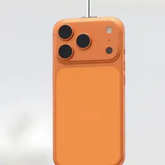 Pomarańczowy iPhone z trzema obiektywami aparatu, wiszący na białym tle. Kiedy premiera iPhone 18?