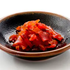 A small bowl of bright red fukujinzuke, a relish often served with Japanese curry. This image could be part of a fukujinzuke recipe.