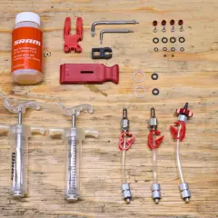 SRAM brake flush and bleed kit with syringes, fluid, and tools. Essential for maintaining hydraulic disc brakes.