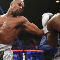 Boxer throws a punch, showcasing the intensity of most popular boxing weight classes.