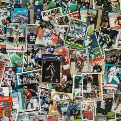 A vibrant collage of sports trading cards, showcasing baseball, basketball, and football players. This collection hints at the world of art consignment, where such memorabilia finds new owners.