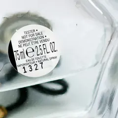 Szklana butelka perfum z etykietą "TESTER NOT FOR SALE". To woda toaletowa, 75 ml.