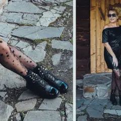 Elegancka kobieta w czarnej sukience z ekoskóry i rajstopach w kropki, pozuje na tle drewnianych drzwi.