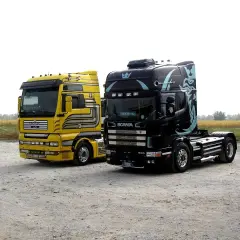 Dwa potężne ciągniki siodłowe: żółty MAN i czarna Scania. Zastanawiasz się, ile waży ciężarówka bez naczepy?