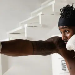A boxer throws a punch, showcasing the precision and strategy that makes boxing the sweet science.