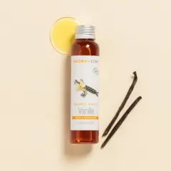 Flacon d'huile de vanille Aroma-Zone, avec des gousses de vanille et une goutte d'huile dorée.