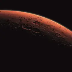 Mars, den röda planeten, med sina kratrar och ojämnheter, badar i solljus. En ensam resa mot mars one.