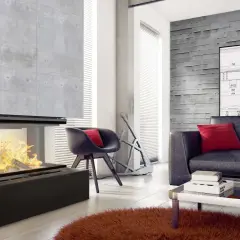 Nowoczesny kominek z betonowym obiciem, idealny do minimalistycznych wnętrz.