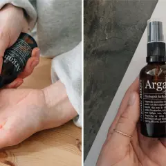 En hand applicerar arganolja för hudvård. Flaskan med ekologisk kallpressad arganolja syns också.