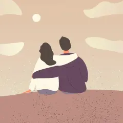 Para dziewczyny, która siedzi przytulona do chłopaka, patrząc na zachód słońca. Idealny moment na szczere komplementy dla dziewczyny.