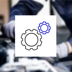 Mechanik bada usterkę. Ikona kół zębatych symbolizuje mechanizm, który może być przyczyną ujemnych korekt paliwowych.