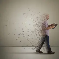 Ein Mann liest ein Buch, während er sich in Fragezeichen auflöst. Ein Symbol dafür, wenn der Glaube nicht mehr passt und Zweifel aufkommen.