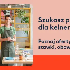 Uśmiechnięty kelner w fartuchu stoi w restauracji, gotowy przyjąć zamówienie. Szukasz pracy dla kelnerów?