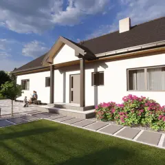 Jasny dom z białymi ścianami i brązowym dachem. Przed wejściem kwitną różowe krzewy. Wnętrze domu kamilek zaprasza do odpoczynku.