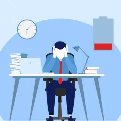 A stressed person at a desk with a low battery icon, symbolizing the need for a thriving mindset to overcome burnout.