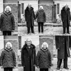 A loving elderly couple, their faces etched with time, stand hand-in-hand. This heartwarming scene offers great photo essay ideas about enduring love and life's journey.