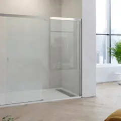 Une douche moderne avec une paroi en verre, parfaite pour nettoyer vitre douche. La salle de bain lumineuse offre une vue sur la ville.
