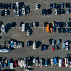 Parking lot full of boats and cars. A small collision occurred during reversing, resulting in a fine.