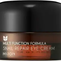 En Mizon Snail Repair Eye Cream-burk. Denna ögonkräm med snigelslem lyko är en del av en multifunktionell formula för huden.