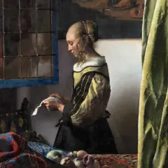 A woman in a yellow and black dress reads a letter by a window, a scene from one of Vermeer's famous paintings of women.