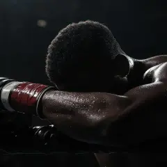 A boxer rests his head on the ropes, sweat glistening. He hopes the judges don't call a draw, as that means no clear winner.