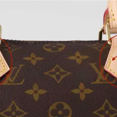 Gros plan sur le **cuir Louis Vuitton** d'un sac, avec un chaton surpris qui regarde par-dessus.