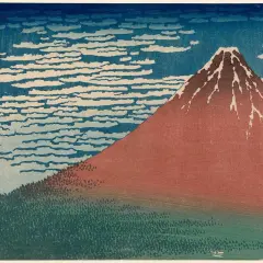 A Katsushika Hokusai artwork depicting Mount Fuji in red, with a forest at its base and a sky filled with swirling clouds.