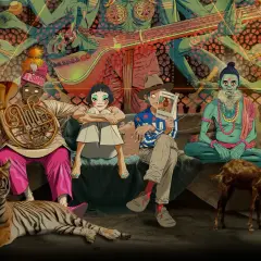 Gorillaz koncerty w Indiach? Postacie siedzą obok tygrysa, kozy i małpy, w tle hinduskie bóstwo.
