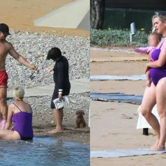 Katy Perry z dziećmi na plaży. Wokalistka w fioletowym stroju kąpielowym trzyma na rękach córkę.