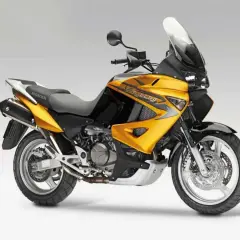 Żółto-czarny motocykl Honda Varadero, gotowy na przygodę.