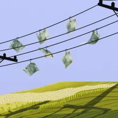 Pieniądze wiszą na przewodach energetycznych, symbolizując wysokie rachunki za prąd. Ile kosztuje energia elektryczna?