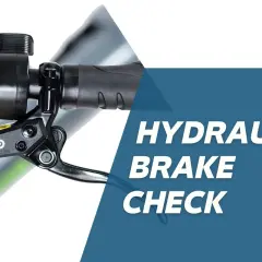 Close-up of an e-bike's hydraulic brake lever and display. Learn about old brake fluid symptoms and how to check your brakes.