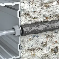 Przekrój kotwy chemicznej w betonie i profilu aluminiowym.