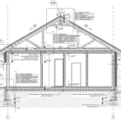 Przekrój budynku z detalami konstrukcyjnymi, uwzględniający warstwy izolacji i materiałów. Projekt architektoniczno budowlany.