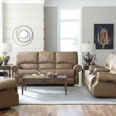 A cozy living room featuring a tan leather sofa and recliners, perfect for a Bassett Furniture identification and value guide.