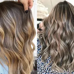 Capelli scalati mossi naturali con sfumature bionde e castane, un look pieno di luce e movimento.